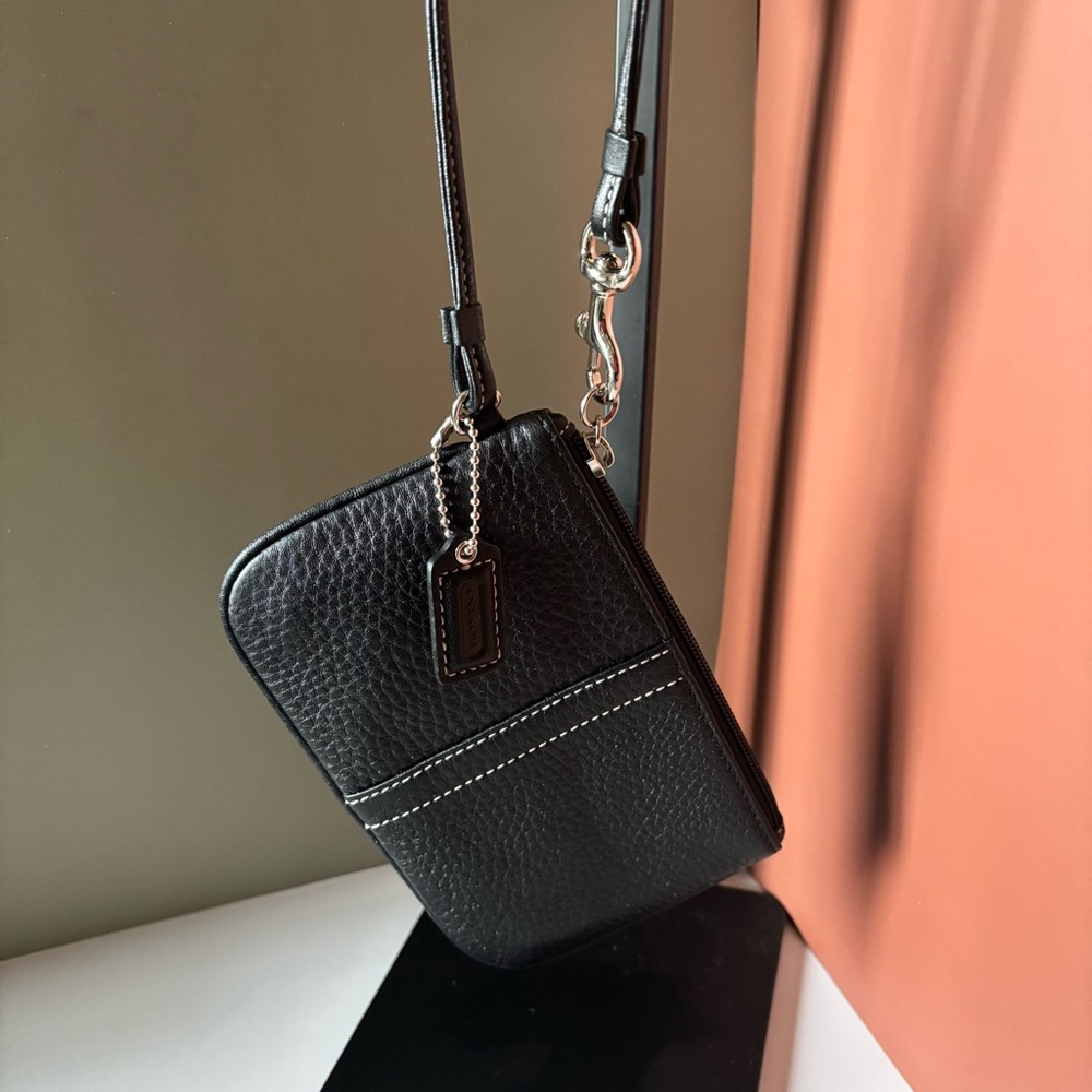 COACH small black pebbled leather wristlet with white stitching